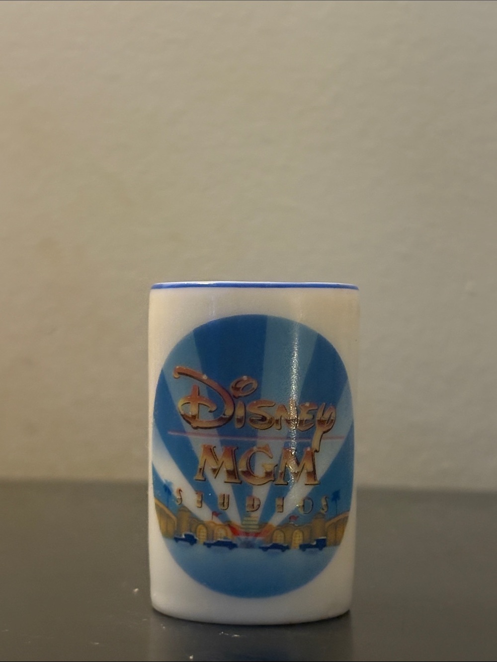 Vintage Disney White, Blue and Gold MGM Studios Ceramic Shot Glass
